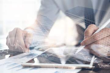 Wall Mural - Businessman analysing financial graph report for business finance and investment background