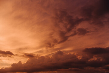 Wall Mural - beautiful sky with orange clouds in sky at sunset . natural background.