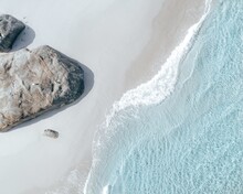 High Angle Top View Shot Of The Sea Waves Brushing The Sand In Western Australia DJI