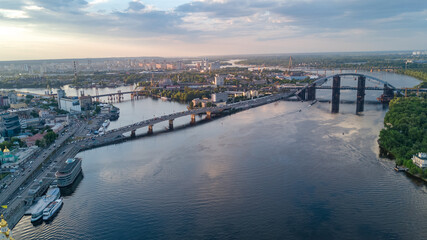 Wall Mural - Kyiv cityscape aerial drone view, Dnipro river, downtown and Podol historical district skyline from above, city of Kiev and Dnieper, Ukraine