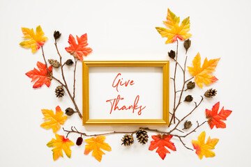 Wall Mural - golden frame with english text give thanks. beautiful, colorful autumn leaf decoration with maple le