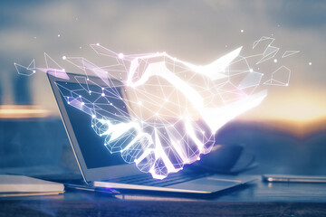 Poster - Desktop computer background in office and handshake hologram drawing. Double exposure. Pertnership concept.