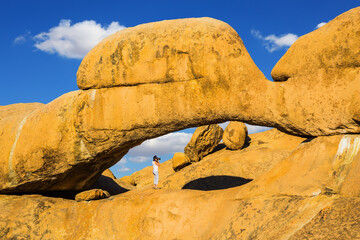 Wall Mural - Woman photographs of stone arches