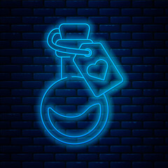 Glowing neon line Bottle with love potion icon isolated on brick wall background. Valentines day symbol. Vector Illustration.