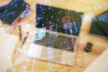 Multi exposure of abstract software development hologram on laptop background, research and analytics concept