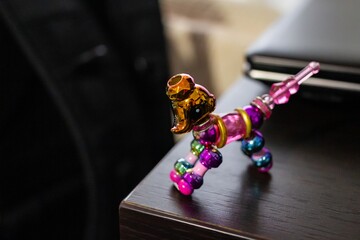 Canvas Print - Closeup shot of twisty pet toy bracelet on a wooden table