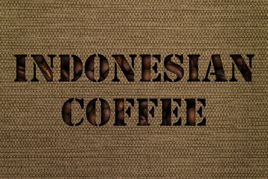 Varieties of Indonesian coffee text made up of coffee beans on a background of canvas fabric