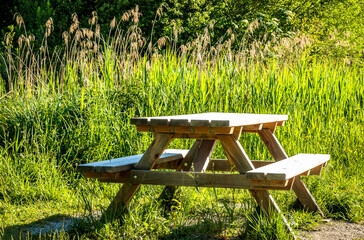 Canvas Print - wooden picnic table at the alps