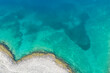 © 26max - Top view drone aerial of coastal cliff rock formation above ocean