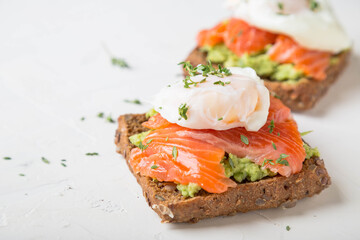 Wall Mural - Sandwich with salmon, avocado and whole grain bread