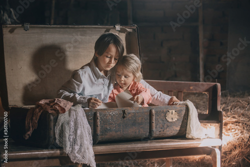 Fotomural Little child, boy, hiding in old vintage suitcase in the attic
