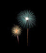 © boonsom - Green and yellow fireworks display on night sky