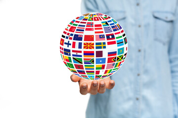 Poster - Collage of young woman holding globe with international flags on white background, free space