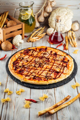 Wall Mural - Barbecue pizza pepperoni red onion and mozzarella