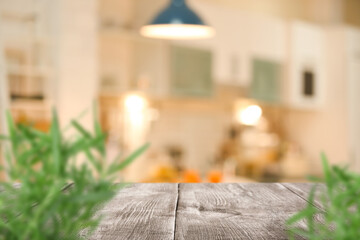 Wall Mural - Wooden table with plants in modern kitchen interior