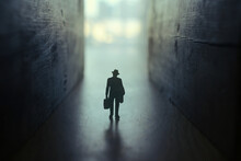 Businessman Walks On An Unknown Road