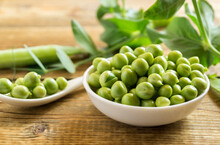 Young Green Peas In A White Bowl