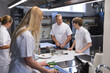 © Wavebreak Media - Group of chefs working at restaurant kitchen
