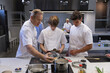 © Wavebreak Media - Group of chefs working at restaurant kitchen