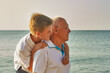 © fisher05 - Happy old man with his grandson on the sea coast
