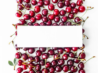 Red ripe cherry berry flat lay view on table with white empty blank mock up. Food summer concept.