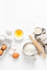 Wall Mural - Baking homemade bread on white kitchen worktop with ingredients for cooking, culinary background, copy space, overhead view