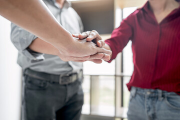 Poster - Business people joining and putting hands together during their meeting