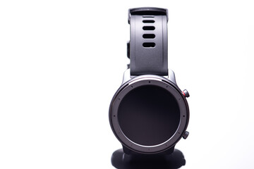 Wireless round, dark smart watch isolated on a white background