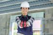 happy woman contractor worker with noise cancelling headphones