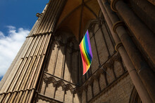 Peterborough, Cambridgeshire, UK, July 2019, A View Of A Pride Flag Hanging From Peterborough Cathedral