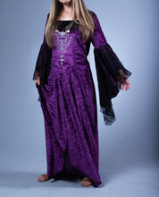 Woman In Long, Purple Fantasy Dress