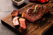 Fresh grilled meat. Grilled beef steak medium rare on wooden board. Picanha. Top view.