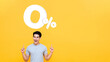 © Atstock Productions - Young handsome Asian man pointing up to 0% on yellow background with copy space for no interest installment payment concept
