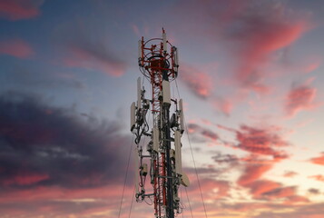 Wall Mural - Telecommunication tower 4G and 5G. Macro Base Station or Base Transceiver Station. Wireless Communication Antenna Transmitter. Development of communication systems in urban area at sunset.