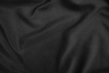 Background texture black cloth. Abstract dark wavy soft. Fabric is wrinkled. Fashion luxury style.