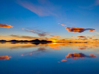 Wall Mural - Super great colourful sunset over the salt lake saline in Salar de Uyuni, Salt Flat, Bolivia