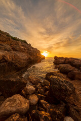 Wall Mural - Sunrise between the rocks of the renega in Oropesa