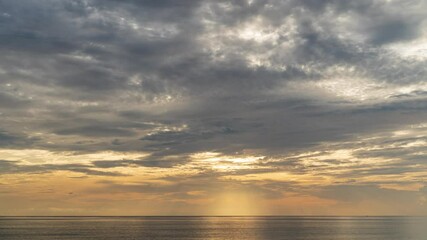Wall Mural - 4k time lapse video scene of ray light on sun beam with moving clouds background