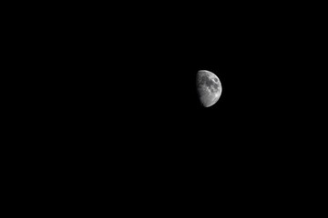 Poster - First quarter moon on a dark background at night in Menorca, Spain