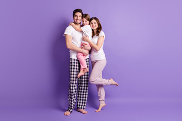 Sticker - Full length body size view of cheerful careful affectionate family three person embracing wearing pajama harmony isolated on bright vivid shine vibrant violet color background