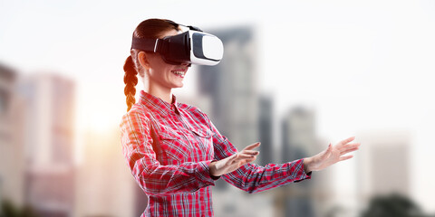 Canvas Print - Girl in checked shirt wearing VR glasses experiencing another reality