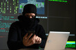 © Grustock - Hacker uses a mobile phone to hack the system. Stealing personal data and money from Bank accounts. The concept of cyber crime and hacking electronic devices
