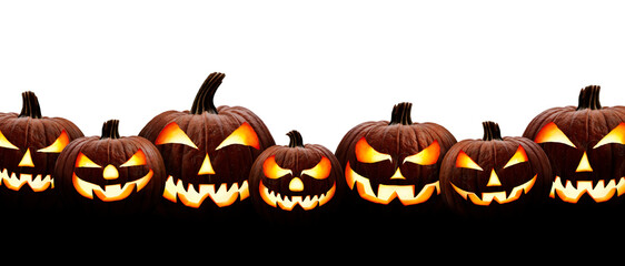 Wall Mural - a large group of seven spooky halloween lanterns, jack o lantern, with evil face and eyes isolated a