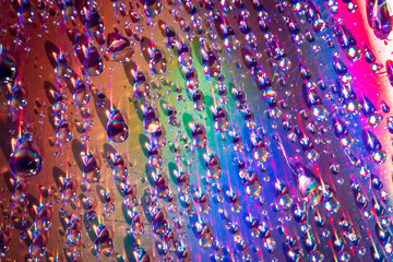 Wall Mural - water drops on dvd media, water drops on colorful background