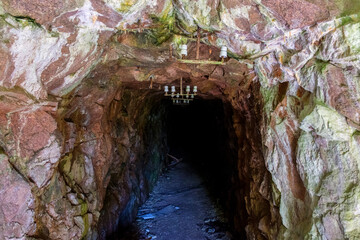 Wall Mural - Dark old mine carved in the mountain