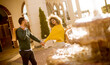 © BGStock72 - Young multiethnic couple walking by the fountain
