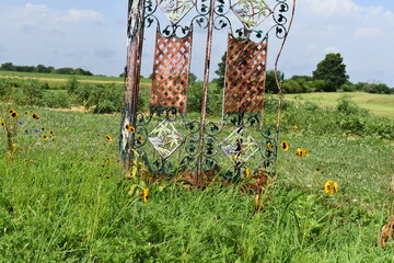 Wall Mural - Wildflowers in Front of a Garden Decoration