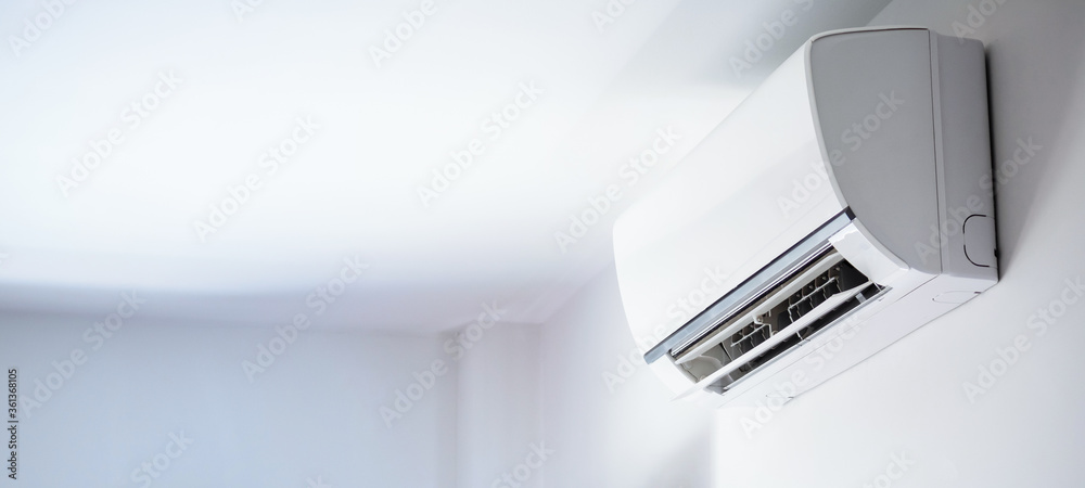 Air conditioner on white wall room interior background - obrazy, fototapety, plakaty 