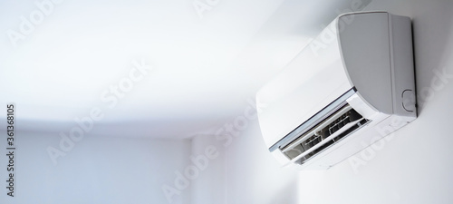 Fotomural Air conditioner on white wall room interior background