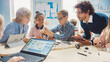 © Gorodenkoff - Elementary School Robotics Classroom: Diverse Group of Brilliant Children with Enthusiastic Teacher Building and Programming Robot. Kids Learning Software Design and Creative Robotics Engineering